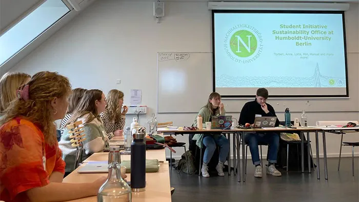 Students around a table at Humboldt Berlin