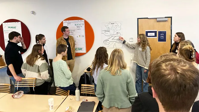 Students presenting their work on posters