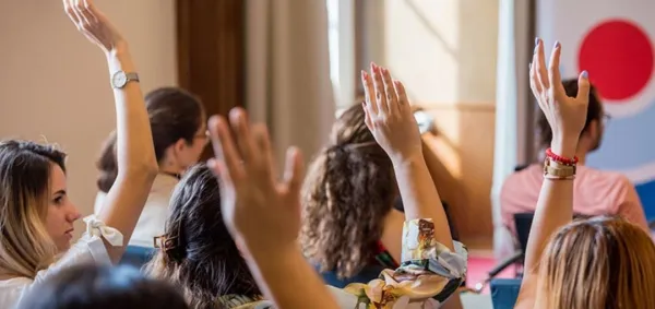 Students raising hands