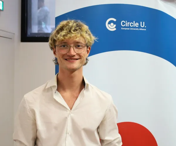 Student smiling at camera.