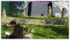 A man sitting on a lawn reading a book